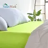 A close-up view of a bed with a bright green fitted sheet and white pillows. Produktbild-Vorschau