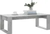 A concrete-look coffee table with a cup of coffee and a stack of books on top. Podgląd zdjęcia produktu
