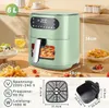A green air fryer is shown on a wooden table with food and drinks around it, along with diagrams of its dimensions and specifications. Podgląd zdjęcia produktu