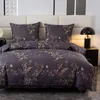 A close-up view of a floral patterned duvet and pillow set on a bed. Anteprima dell’immagine prodotto