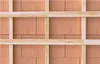A close-up view of a brick wall with wooden framing. Voir les images du produit