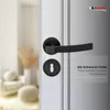 A black door handle set with a keyhole escutcheon is shown on a white door, with a blurred background of a room interior. Text and a logo are present. Produktbild-Vorschau