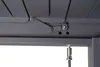 Close-up view of the underside of a pergola roof mechanism, showing the adjustable lamella hinge and a cable attachment. Produktbild-Vorschau