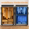 Two fabric wardrobes with clothes inside, one filled with clothes in warm tones and the other with clothes in cool tones. Produktbild-Vorschau