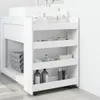 A white, narrow storage cart with four shelves is placed next to a white bathroom vanity. The cart is filled with various toiletries and towels. Voir les images du produit