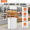 A white portable display counter with a blank sign on top, set up in what appears to be a bakery or food market. Náhľad obrázku produktu