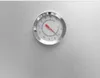 A close-up shot of a thermometer on a metallic surface. Produktbild-Vorschau