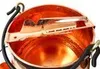 Close-up view of the inside of a copper bucket with tongs resting on the rim. Produktbild-Vorschau