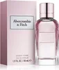 A bottle of Abercrombie & Fitch First Instinct For Her Eau de Parfum for women is displayed next to its packaging. Podgląd zdjęcia produktu