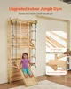 A young girl is playing on a wooden indoor jungle gym attached to a wall. Anteprima dell’immagine prodotto