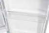 An interior view of a refrigerator compartment, focusing on a clear plastic shelf. Podgląd zdjęcia produktu