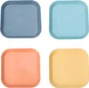 Four colorful square plates arranged in a 2x2 grid on a white background. Produktbild-Vorschau