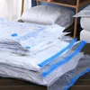 Several vacuum seal bags filled with bedding are stacked on a surface. Voir les images du produit