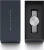 A Daniel Wellington watch is displayed in its dark blue packaging box, with the watch itself presented inside the box on a black insert. Produktbild-Vorschau