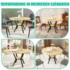 Collage of four different scenes showing a round wooden dining table with a black metal base and a shelf, set in various room decors with different chairs. Produktbild-Vorschau