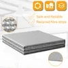 A stack of silver insulation foil sheets with icons and text highlighting features. Produktbild-Vorschau