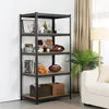 A black metal shelving unit with wooden shelves, filled with various decorative items and storage baskets, placed in a room with a sofa and curtains. Produktbild-Vorschau