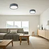 A modern living room with a sofa, coffee table, and a sideboard. Produktbild-Vorschau