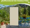 An outdoor patio scene with a screen divider, table, and chairs. Voir les images du produit