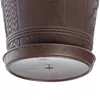 Close-up view of the bottom of a brown plastic plant pot with a wooden texture and a matching saucer. Podgląd zdjęcia produktu