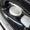 A close-up view of the temperature control dial on a black steam iron. Produktbild-Vorschau