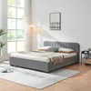 A bedroom scene with a bed, nightstand, and lamp. Produktbild-Vorschau