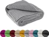 A folded gray knitted blanket is shown. Náhľad obrázku produktu