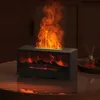 A decorative electric fireplace with a flame effect sits on a glass table, with a diffuser in the background. Náhľad obrázku produktu