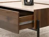 Close-up of an open drawer on a wooden coffee table. Náhled obrázku produktu