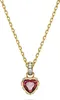 A gold necklace with a heart-shaped red pendant and clear stones. Náhľad obrázku produktu