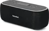 A black TechniSat VIOLA BT 1 portable Bluetooth speaker is shown from a diagonal angle against a white background. Produktbild-Vorschau