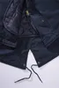 A close-up view of the inside of a navy blue parka jacket. Náhled obrázku produktu