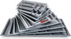 A stack of empty cutlery trays, made of metal, are arranged in a pile. Produktbild-Vorschau