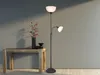 A floor lamp with two lights stands next to a wooden console table with a vase of flowers and a small bowl. Náhled obrázku produktu