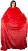 A woman wearing a red blanket sweatshirt. Náhled obrázku produktu