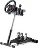 A gaming steering wheel, shifter, and pedal set mounted on a stand, photographed against a white background. Náhled obrázku produktu
