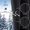A close-up view of a black curtain with text and graphics highlighting its features, set against a snowy outdoor scene. Produktbild-Vorschau