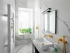 A modern bathroom with a sink, mirror, and plants on the windowsill. Náhled obrázku produktu