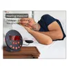 A man sleeping in bed next to an alarm clock with a vibrating puck. Náhľad obrázku produktu