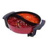 A split hot pot filled with ingredients, photographed against a white background. Podgląd zdjęcia produktu