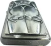 A close-up, angled view of a Zippo lighter with a sculpted design of a woman's buttocks. Podgląd zdjęcia produktu
