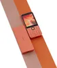 Two Nokia 215 4G phones are displayed on a diagonal split background of light pink and orange. Náhled obrázku produktu