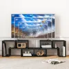 A black modular TV stand with various compartments, displaying books, decorative items, and a vintage radio. A large television screen is mounted above the stand, showing a composite image of different TV sizes with hot air balloons. Voir les images du produit