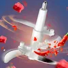 Close-up of a food chopper blade with pieces of meat and chili peppers flying around it. Produktbild-Vorschau
