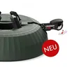 A close-up view of a green Christmas tree stand with a red 'NEU' (new) badge. Podgląd zdjęcia produktu