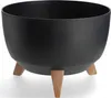 A black planter pot with three brown legs is shown against a white background. Produktbild-Vorschau