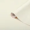 A roll of white adhesive film is shown diagonally on a light background. Náhled obrázku produktu