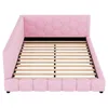 A pink upholstered bed frame with a slatted mattress support. Podgląd zdjęcia produktu