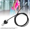 A person using a gym cable in a gym setting. Podgląd zdjęcia produktu