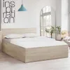 A bed in a room with a poster and a mirror. Náhled obrázku produktu